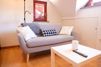 a living room with a couch and a table at B8 apartment in Bohinj