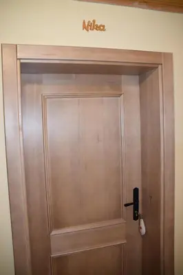 a wooden door with a nissan sign above it at Farm Stay 