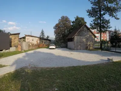 a car parked in a driveway next to a barn at Pearl of Sava Wild Waters in Ljubljana