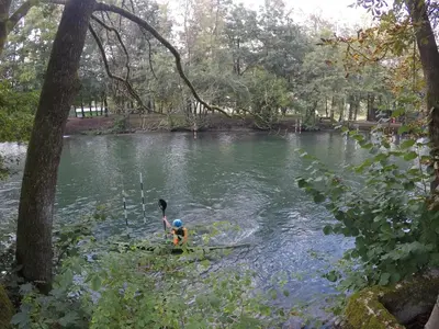 a person in a paddle boat on a river at Pearl of Sava Wild Waters in Ljubljana