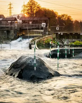 a rock in the middle of a river with water at Pearl of Sava Wild Waters in Ljubljana