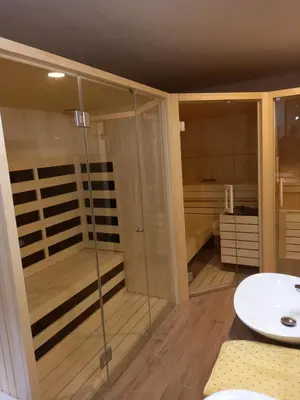 a bathroom with a shower and a sink at Apartments Tubej in Bohinj