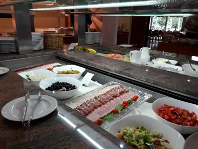 a buffet line with many different types of food at Terme Zreče – Hotel Atrij in Zreče