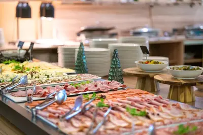 a buffet line with many different types of food at Terme Banovci - Hotel Zeleni Gaj in Banovci