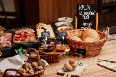 a table with baskets of food and other foods at Terme Banovci - Hotel Zeleni Gaj in Banovci