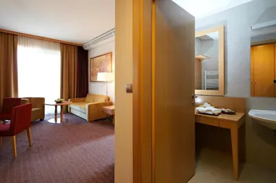 a hotel room with a sink and a bathroom at Grand Hotel Primus - Terme Ptuj - Sava Hotels & Resorts in Ptuj