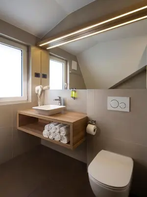 a bathroom with a sink and a toilet at Ahotel Ljubljana in Ljubljana
