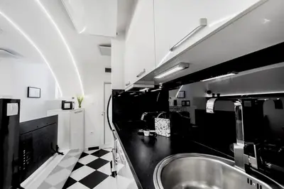 a black and white bathroom with a sink at Black and White Studio in Ljubljana