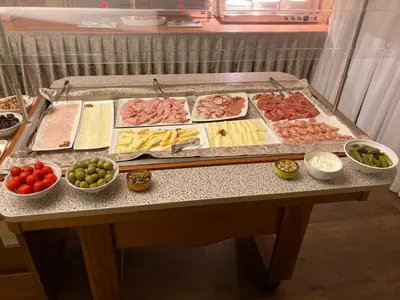 a table with many different types of food on it at Safir Hotel Casino in Sežana