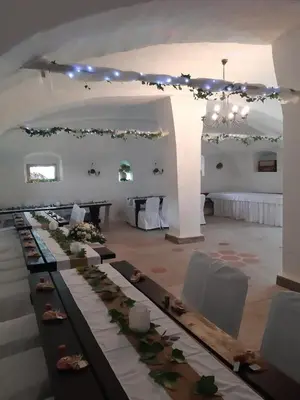 a set up for a wedding in a white room at Country House Zunko in Jelovec
