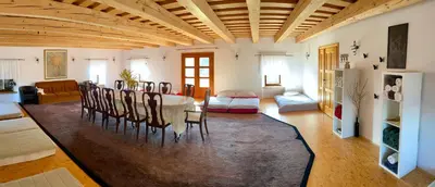 a living room with a table and chairs at Country House Zunko in Jelovec