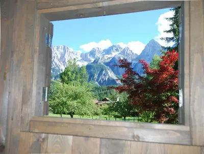 a window with a view of a mountain at Apartments Trata in Kranjska Gora