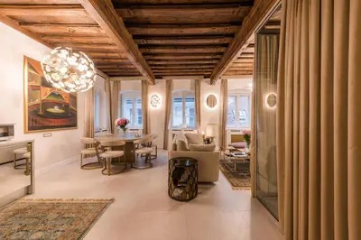 a living room with a table and chairs at AB Ljubljana - The Residence in Ljubljana