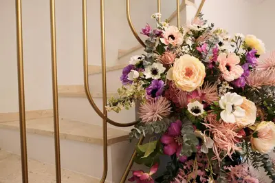 a bunch of flowers on a stair case at Bloom Hotel in Ljubljana