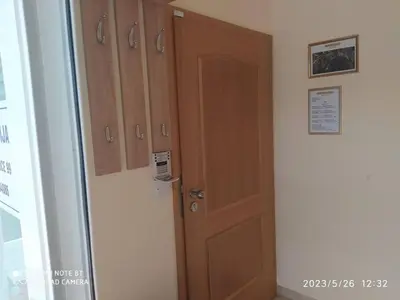 a room with wooden cabinets and a door at Apartment Lucija-Terme Šmarješke Toplice in Smarjeske Toplice