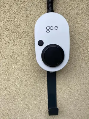 a white object with the word ego on it on a wall at Apartments & Rooms Preseren in Bled