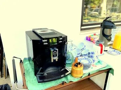 a coffee maker sitting on top of a table at Apartments & Rooms Preseren in Bled