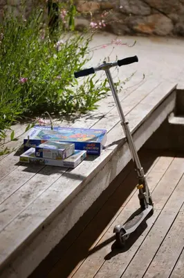 a small scooter sitting on a wooden table at Kambra in Dutovlje