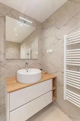 a bathroom with a sink and a mirror at Gostilna Logar in Hotemaže