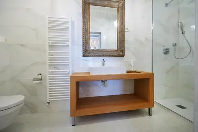 a bathroom with a sink and a mirror at Hiša Ančka, Boutique Hotel & Maja Rooms in Slovenj Gradec