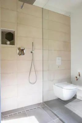 a shower stall with a toilet in a bathroom at Woodywood house Bohinj in Polje