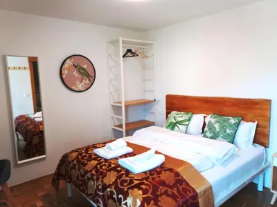 a bedroom with a bed with two towels on it at Pension MOYCHI in Bled