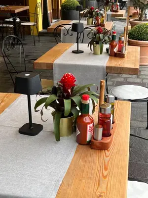 a table with a bunch of condiments on it at Kotnik Superior Boutique Hotel in Kranjska Gora