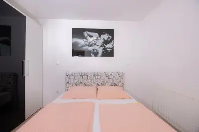 a bedroom with a bed with an orange mattress at Apartment Arnika Kranjska Gora in Kranjska Gora