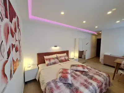 a bedroom with a bed and two pillows on it at Restaurant & Apartments Getaway Pri Kobalu in Vipava