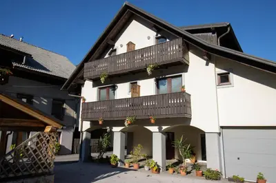 an example of a house with a balcony at Rooms Cvitar - Center in Kranjska Gora