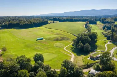 an aerial view of a golf course at Hotel Grad Otočec - Relais Chateaux in Otočec
