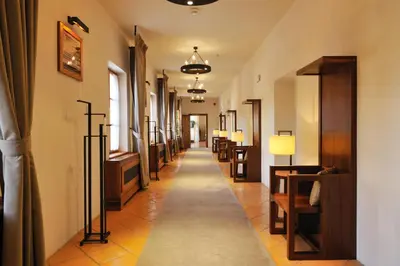 a long hallway with a row of dressing rooms at Hotel Grad Otočec - Relais Chateaux in Otočec