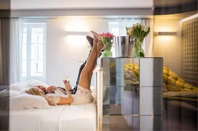 a woman laying on a couch with her legs in the air at Vander Urbani Resort - a Member of Design Hotels in Ljubljana