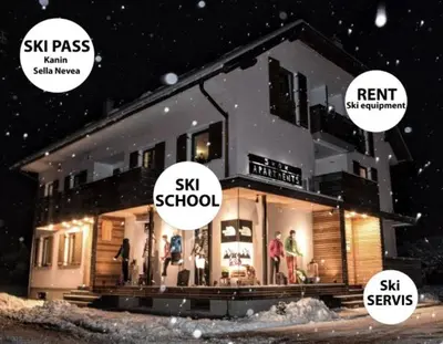 a house in the snow with someysicalysicalysicalysicalysicalysicalysicalysicalysical at Apartments Skok with rafting and free parking in Bovec