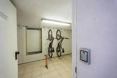 a room with four bikes hanging on the wall at Berghi Hotel and Apartments in Kranjska Gora
