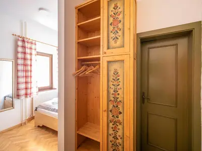 a room with a door and a room with a bedroom at Berghi Hotel and Apartments in Kranjska Gora