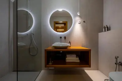 a bathroom with a sink and a mirror at Hotel Lipa in Kranjska Gora