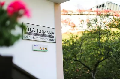 a sign on the side of a building at Vila Romana in Kranjska Gora