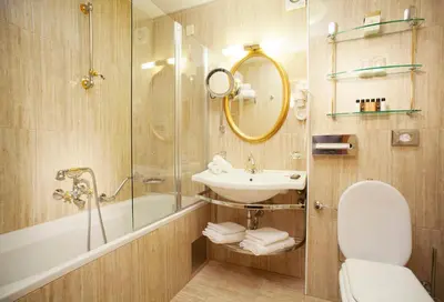 a bathroom with a sink and a tub and a toilet at Grand Hotel Toplice - Small Luxury Hotels of the World in Bled