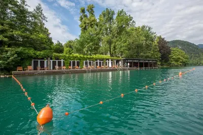 an orange buoy on a rope in the water at Vila Bled in Bled