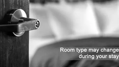a door knob on a wooden door with the words roomype may change during your at Alp Pension in Bled