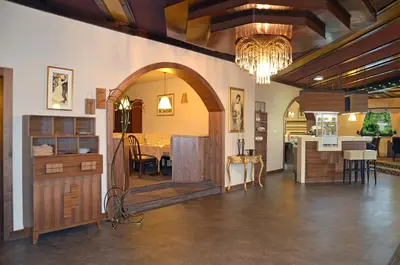 a room with an archway and a dining room at Hotel Leonardo in Slovenska Bistrica