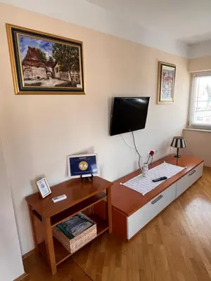 a room with a desk and a tv on a wall at Peaceful 4-room house in Maribor - ski friendly in Maribor