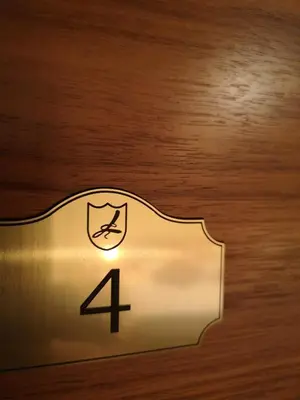 a sign on a door with the number four on it at Domačija Linč in Rodik