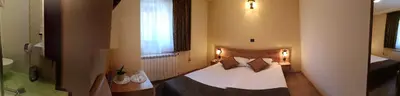 a bedroom with a bed and a window at Domačija Linč in Rodik