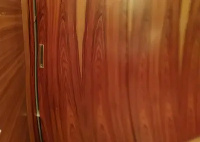 a close up of a wooden door in a room at Domačija Linč in Rodik