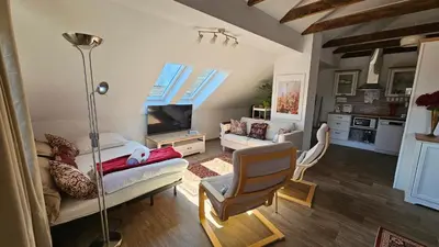a living room with a couch and a tv at Apartment Panorama & Bella Vista in Bohinjska Bela