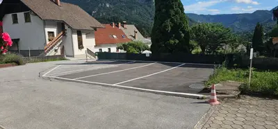 a parking lot with a tennis court at Apartment Panorama & Bella Vista in Bohinjska Bela