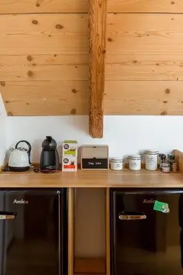 a kitchen with a wooden counter top and a stove at Hiša na soncu / Sun house in Zgornje Gorje