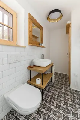 a bathroom with a toilet and a sink at Hiša na soncu / Sun house in Zgornje Gorje